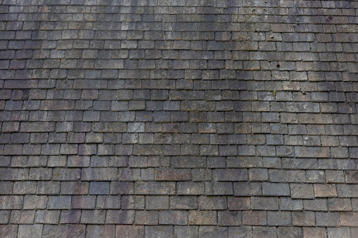 Black Marks on Roof A gray slate roof is pictured with black marks.